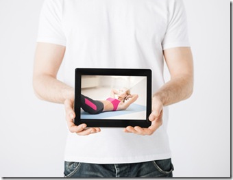 man with tablet pc and sporty woman